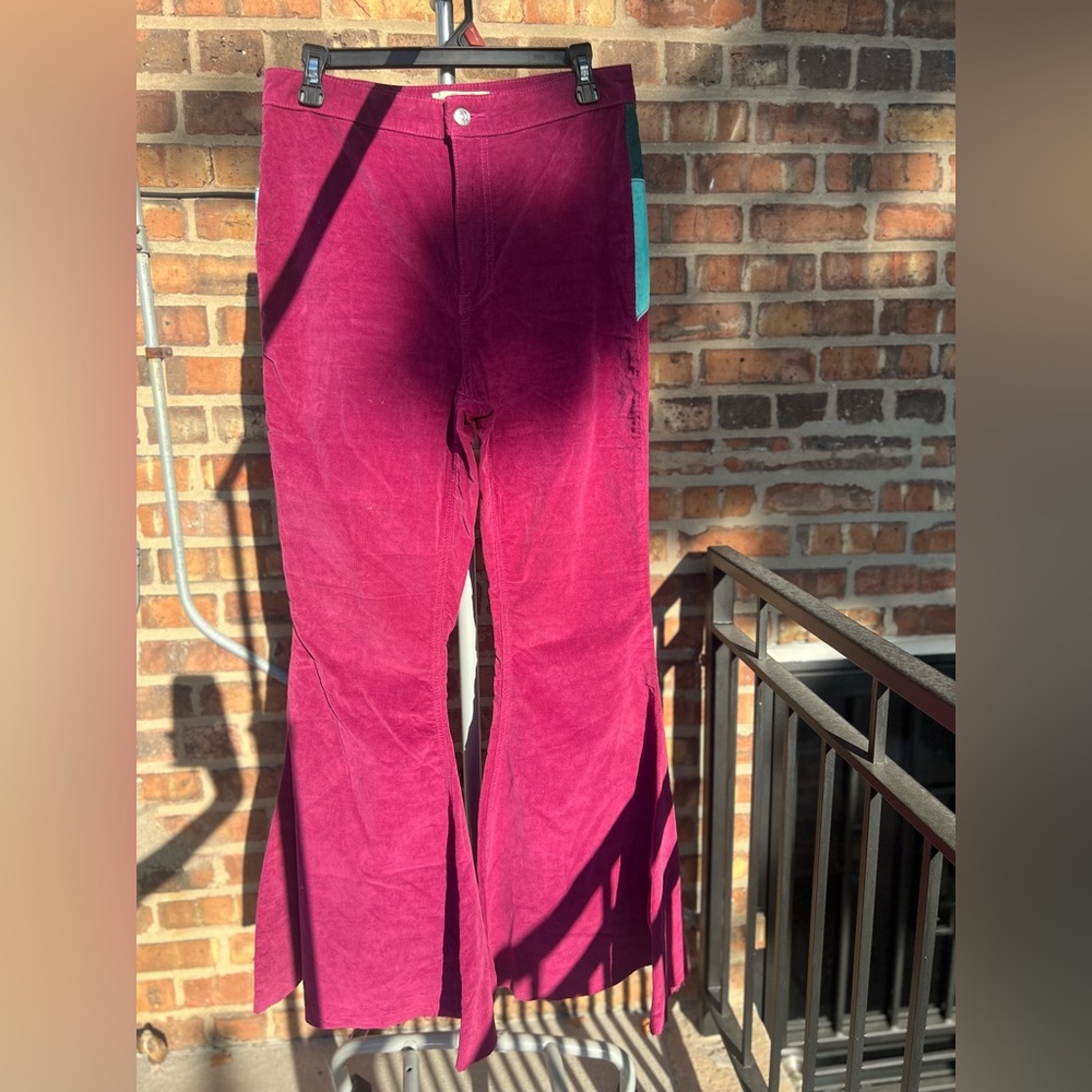Free people purple corduroy flare pants with sunrise on backside. Size 31